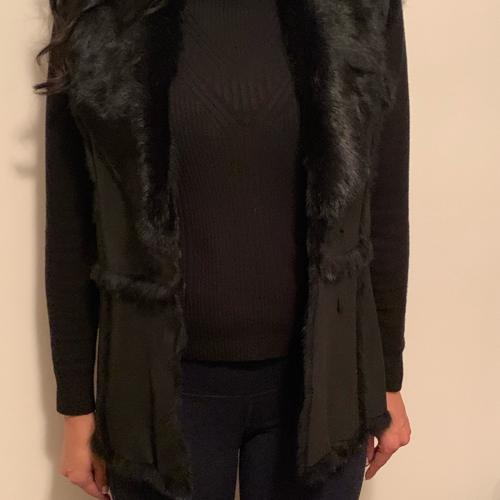 Black for sleeveless vest in good condition